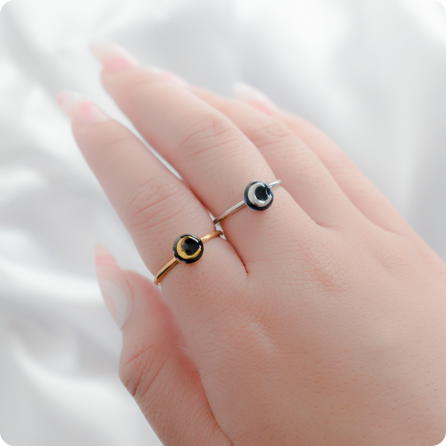 Celeste Faerie Gold and Silver Luna Ring close-up on fingers