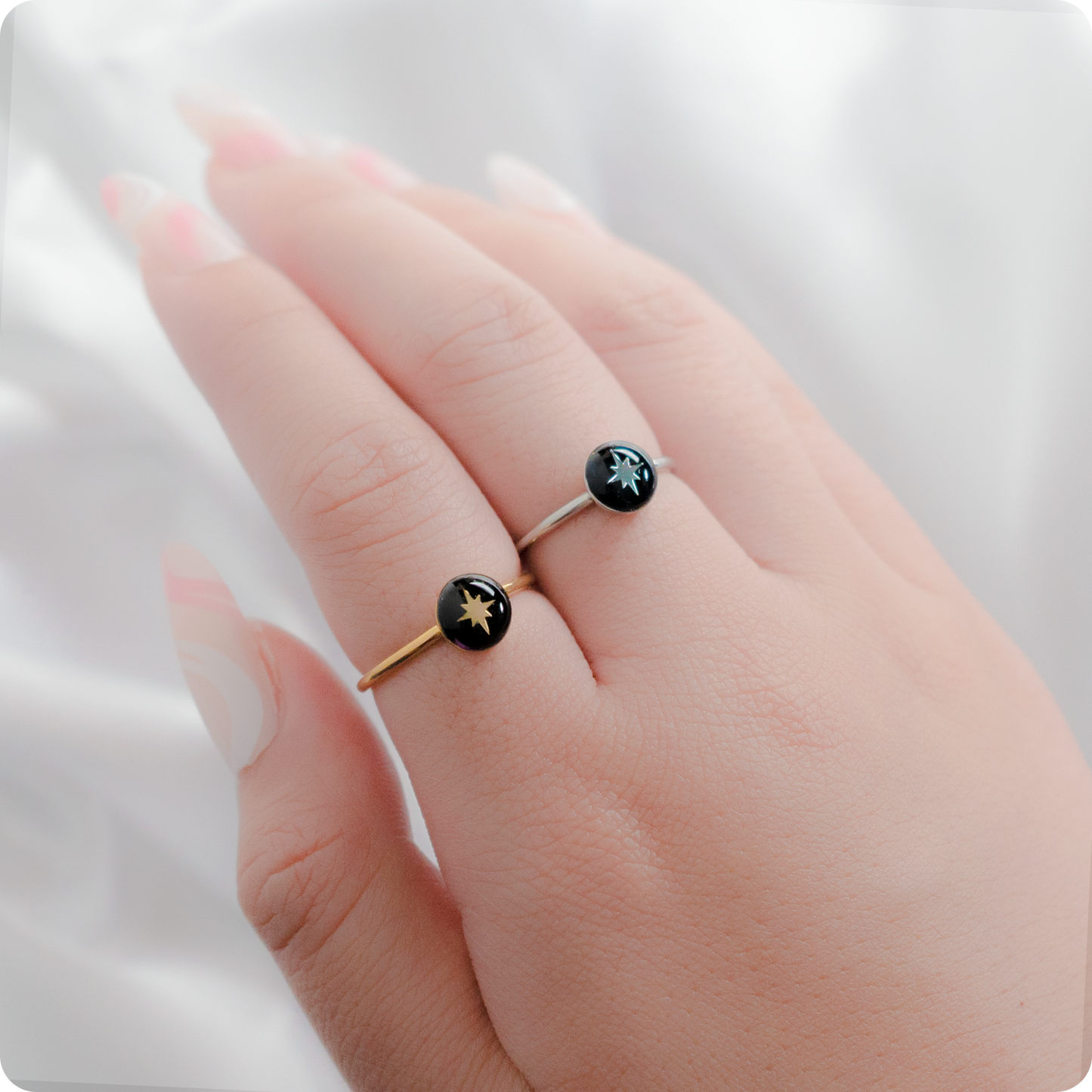 Celeste Faerie Gold and silver Sol Ring close-up on fingers