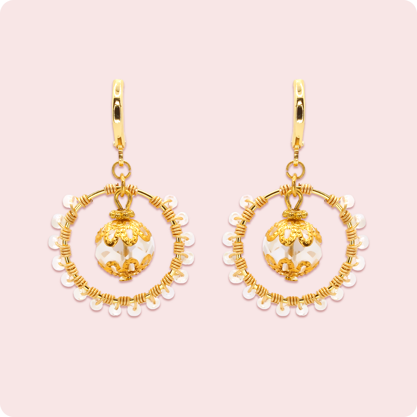 Celeste Faerie Sol Earrings close-up on pink background
